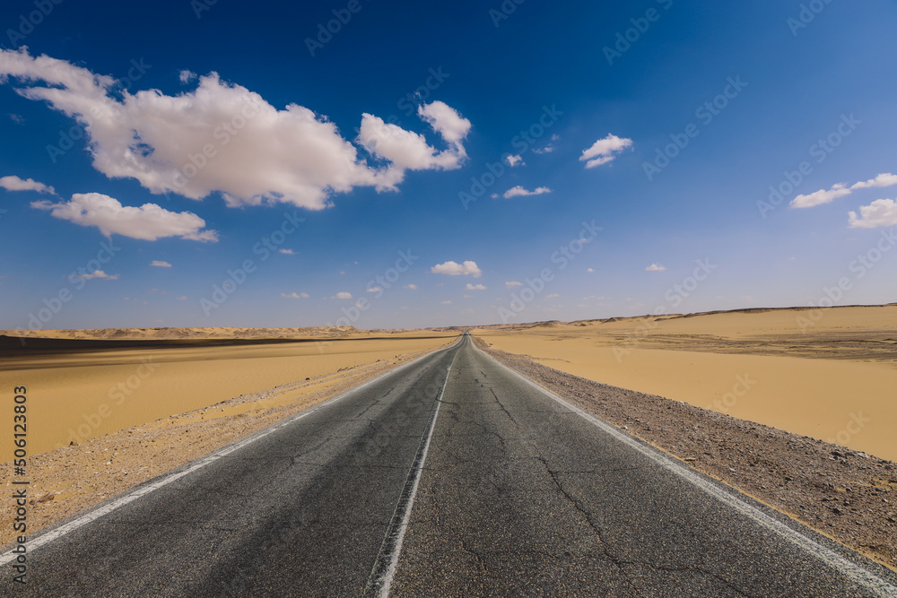 Naklejka premium Asphalt Road View of the White Desert Protected Area in the Farafra Oasis, Egypt