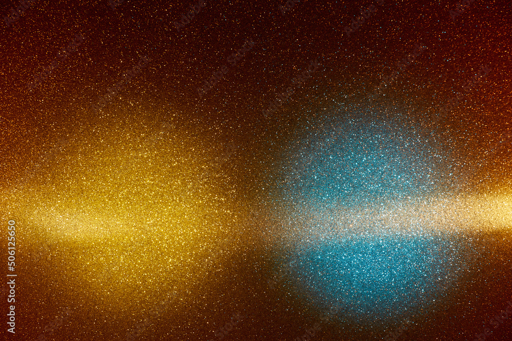 Obraz premium On a gradient dark yellow background in fine grain, blue and yellow clouds of light