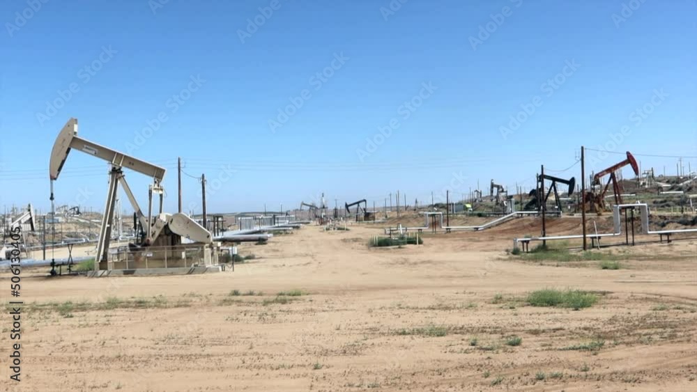 Crude Oil Pumps in an Oil Field Pumping Oil at Normal Speed Crude Oil Pumps in an Oil Field Pumping Oil at Normal Speed