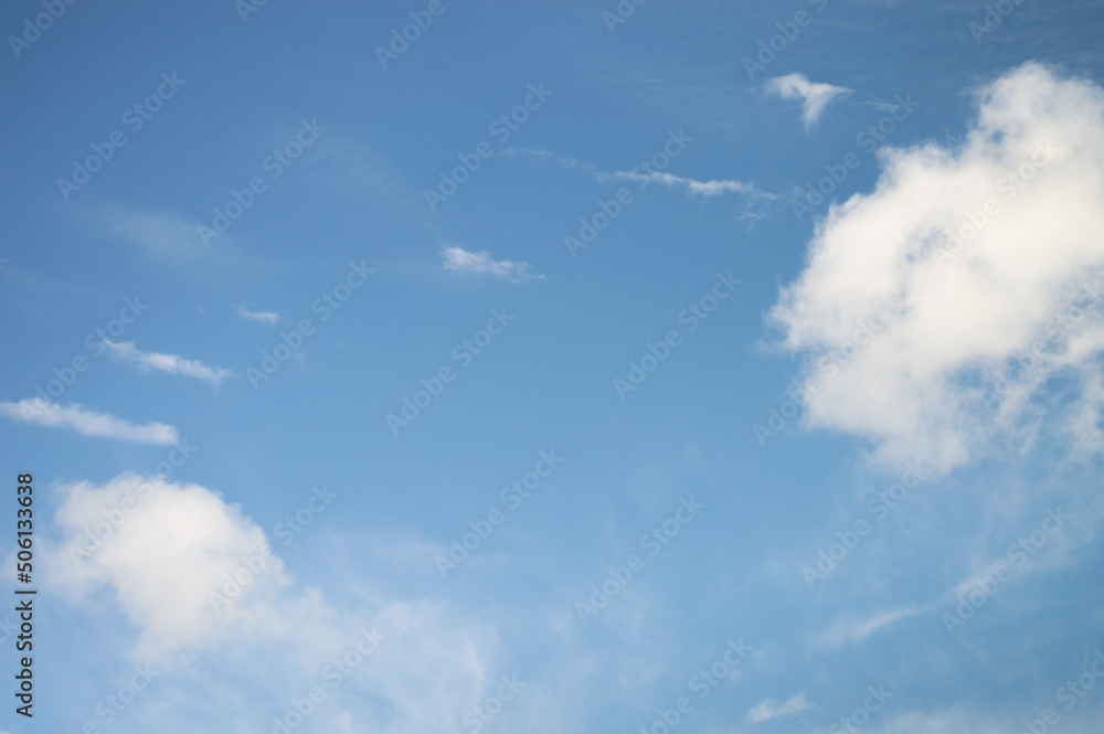 Blue sky with parallel stripes of chemical trails Blue sky with parallel stripes of chemical trails