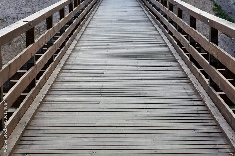 Wooden old dirty bridge. The use of wood in everyday life Wooden old dirty bridge. The use of wood in everyday life
