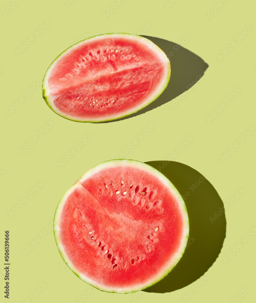 Cut watermelon on green pastel background Cut watermelon on green pastel background