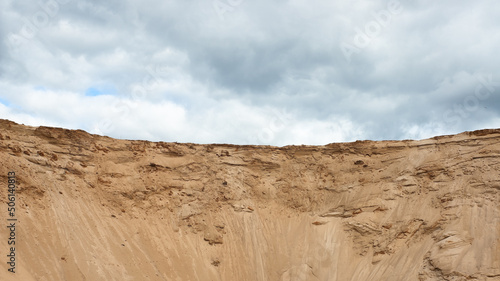 a sand quarry  in the photo a sand quarry and a gray sky in the background