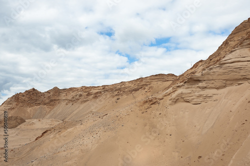 a sand quarry, in the photo a sand quarry and a gray sky in the background