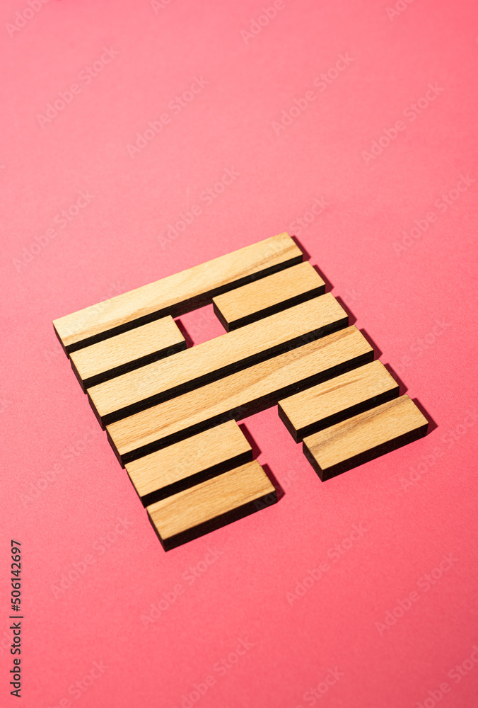 Gene Key 56 wood hexagram i ching on pink background Gene Key 56 wood hexagram i ching on pink background