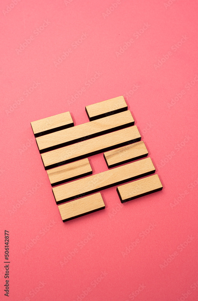 Gene Key 47 wood hexagram i ching on pink background Gene Key 47 wood hexagram i ching on pink background