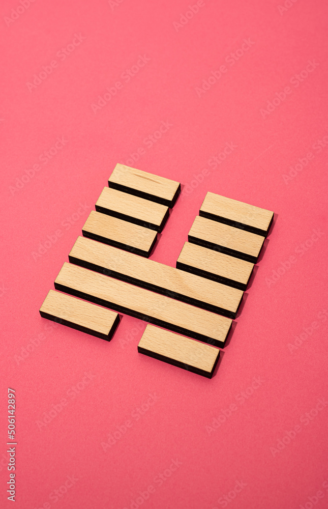 Gene Key 46 wood hexagram i ching on pink background Gene Key 46 wood hexagram i ching on pink background