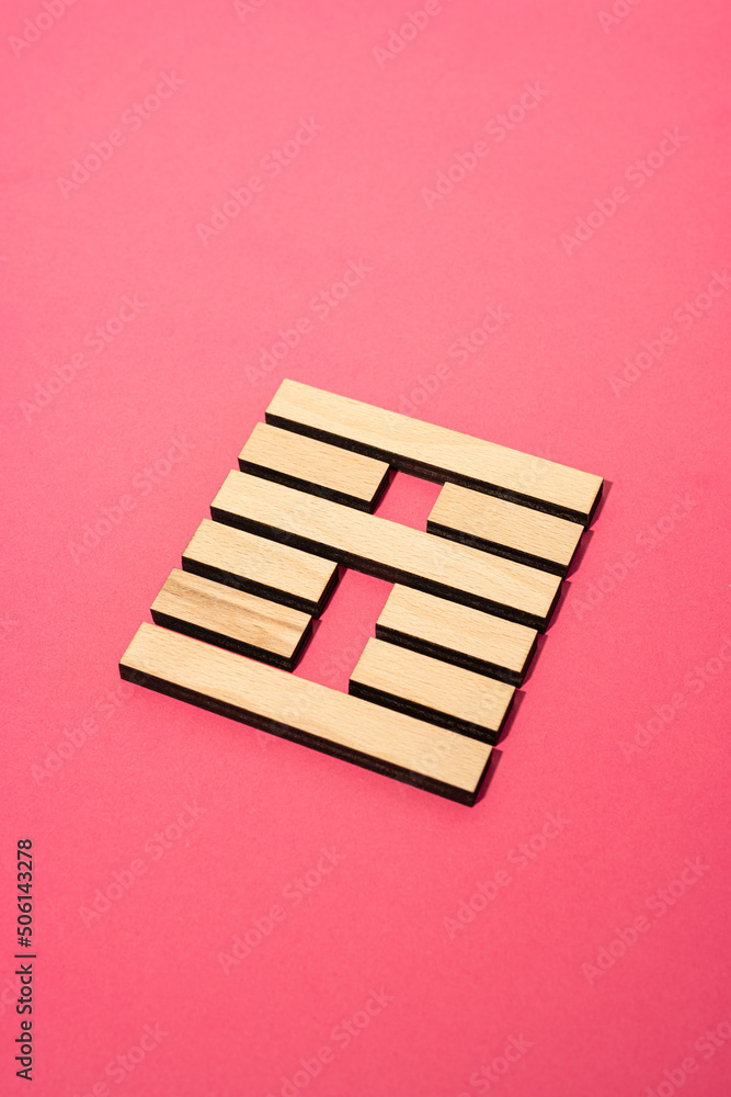 Gene Key 21 Hexagram wood i ching on pink background Gene Key 21 Hexagram wood i ching on pink background