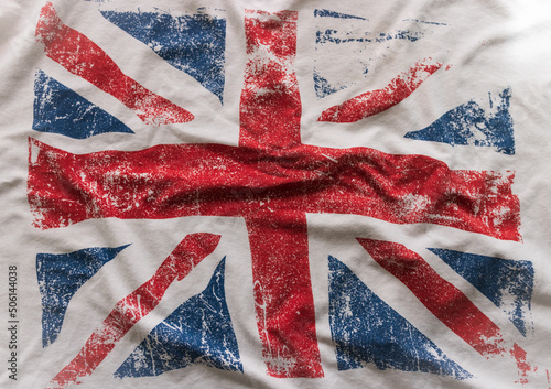 Textured background of the British flag in white, red and blue national colors. blur, defocus.