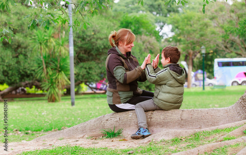 happy grandmother with her grandson in the park