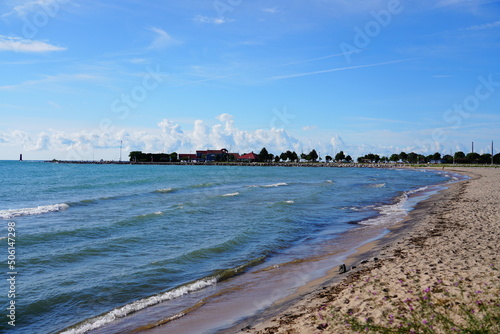 Sandy beach is on the shoreline of Lake Michigan in Sheboygan  Wisconsin.