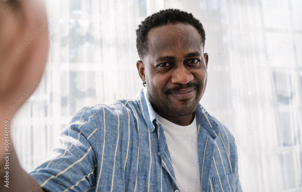 Portrait of  handsome afro African American  man use smartphone selfie say hi over white background. Happy guy online influencer blogger. Education technology connected people man lifestyle, worker.