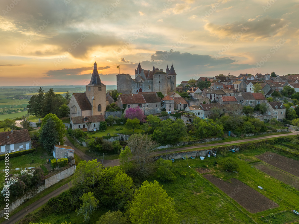 Aerial view of Châteauneuf-en-Auxois castle and medieval village one of the most beautiful villages of France with colorful sunset sky