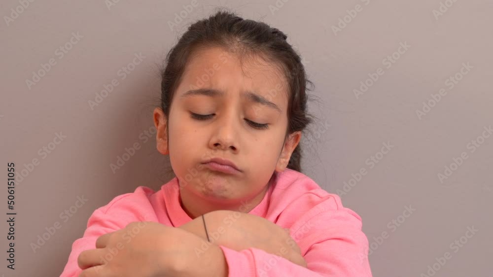 Unhappy and lonely little boy.
The lonely and unhappy child sitting by the wall. Sad and stressed, he bows his head.
