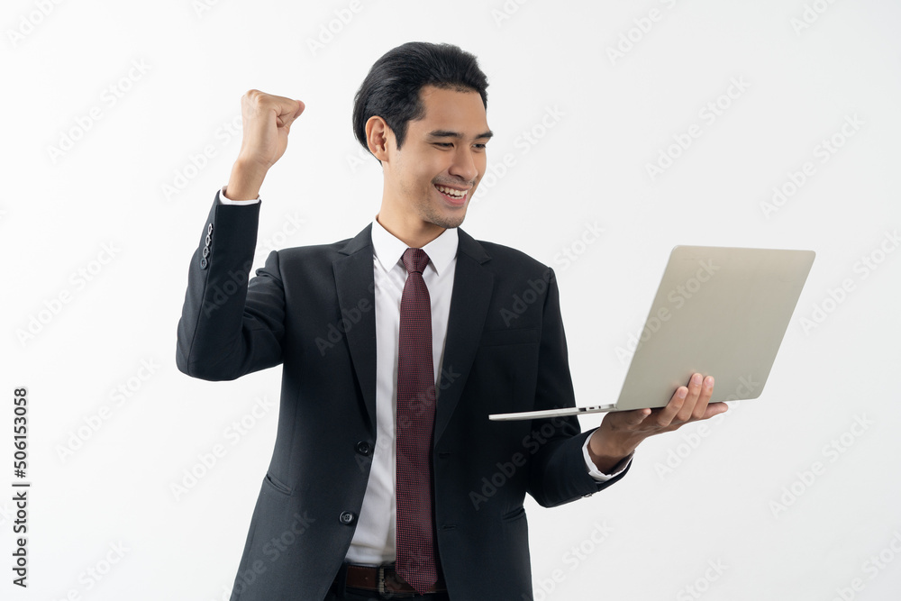 winner young asian businessman smiling and celebrating his success. winner young asian businessman smiling and celebrating his success.
