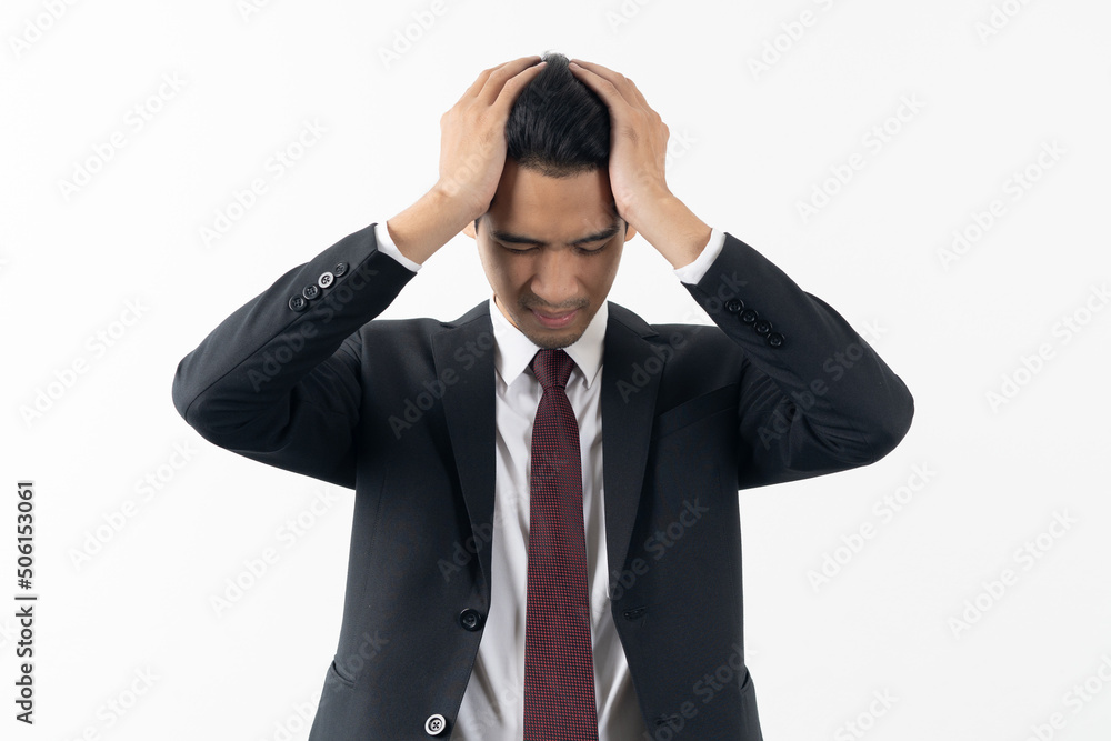 asian young businessman have a headache isolated on white background asian young businessman have a headache isolated on white background