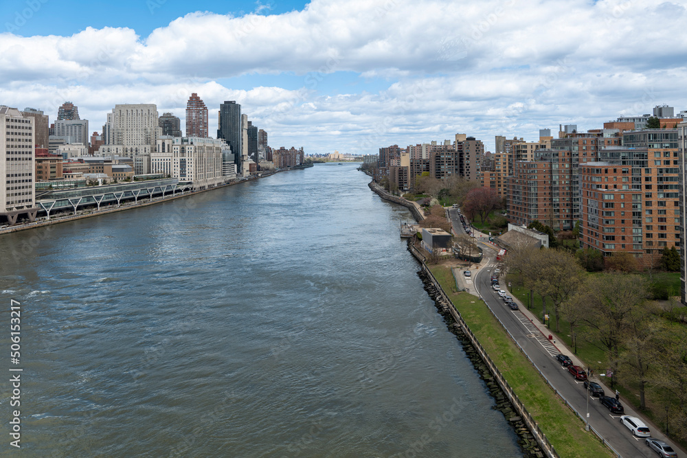 New York City skyscrapers on the river canal have a cloudy and blue sky background. High-quality photo New York City skyscrapers on the river canal have a cloudy and blue sky background. High-quality photo