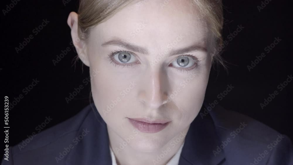 Beautiful close up portrait of a confident young business woman looking into camera Beautiful close up portrait of a confident young business woman looking into camera