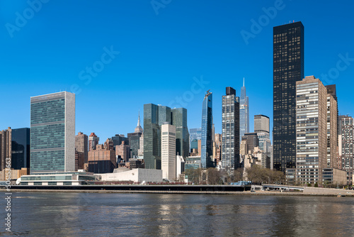  New York City skyscrapers on the river canal. High-quality photo