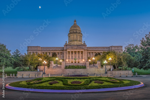 Illuminated Kentucky State Capitol at dusk with warm lights illuminating this great capitol with a blue sky  on a warm summer evening in Frankfort, KY. photo