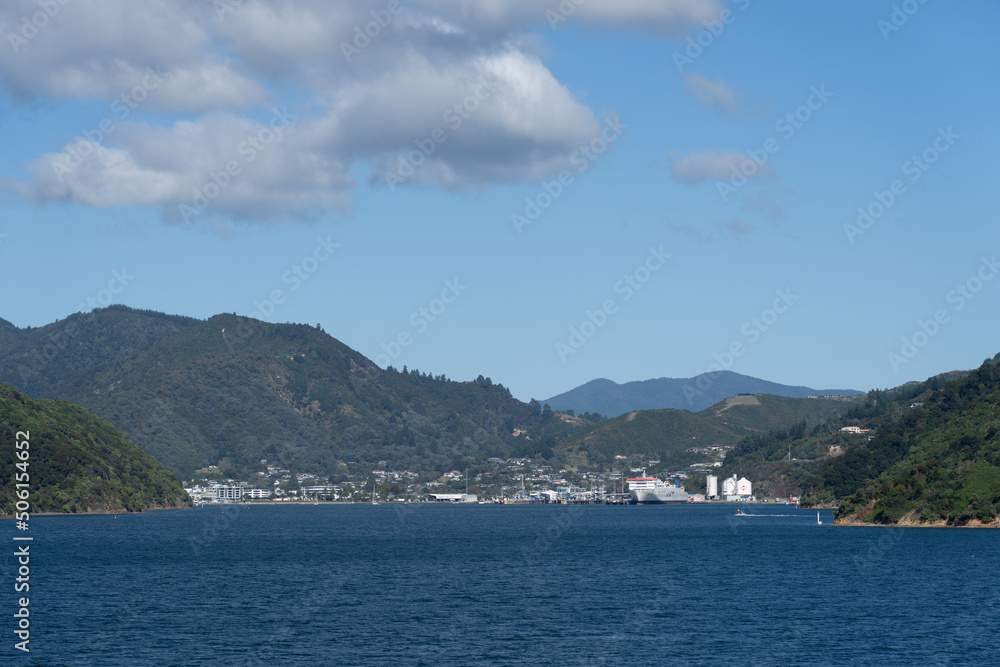 Small port town of Picton in distance as ferry arrives from Wellington