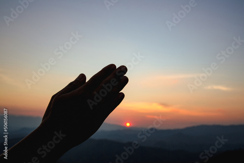 woman worship on sunset © doidam10