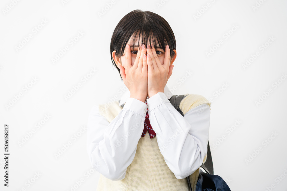 手で顔を覆う女子高校生 Stock Photo | Adobe Stock