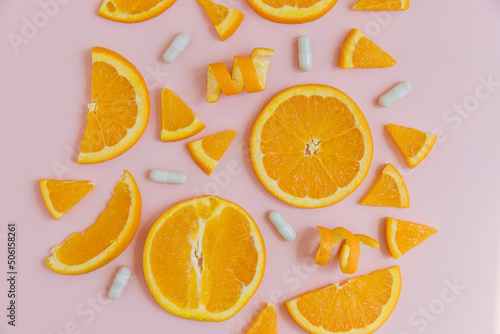 Organic Orange slices on a pink background