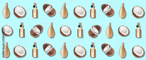Cosmetics with coconut on light blue background. Pattern for design