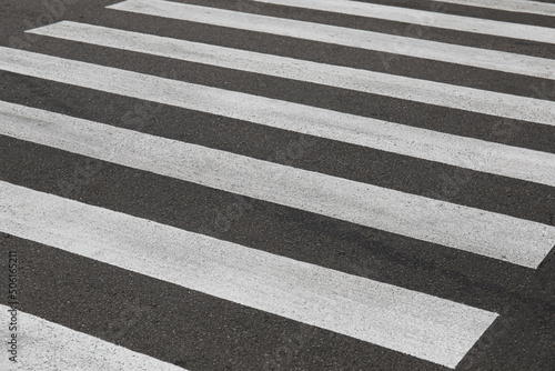 Zebra crosswalk on road in city