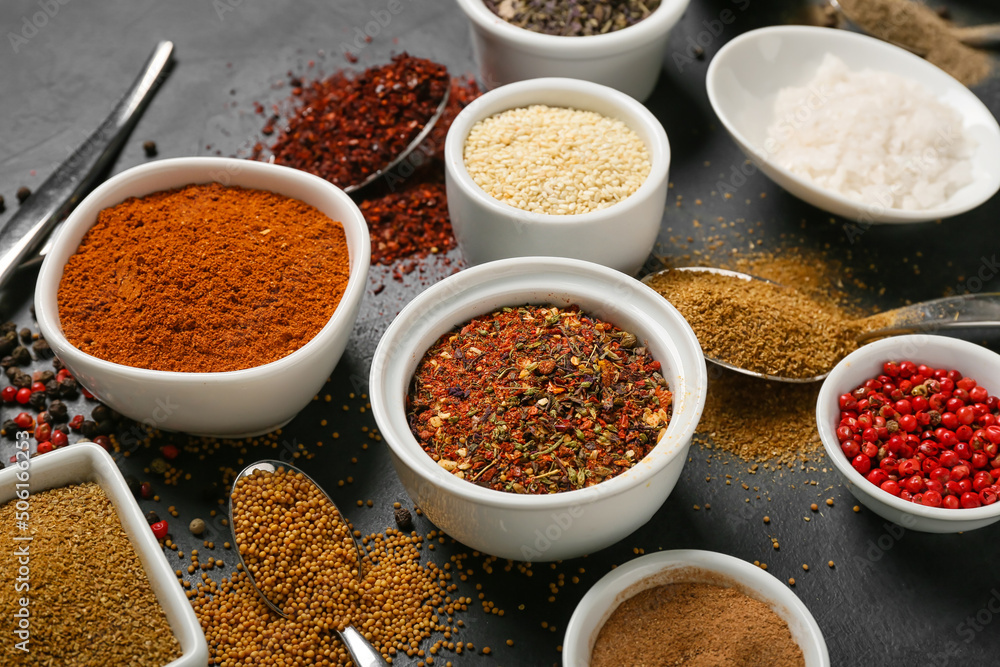 Set of aromatic spices on dark background, closeup Set of aromatic spices on dark background, closeup