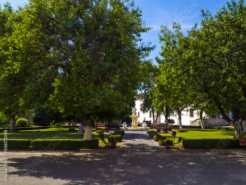 Park with Marble fountain near Palace building of the medieval Dubno Castle. Travel destinations in Ukraine. Scenic view of the castle, which was founded by Konstantin Ostrogski.