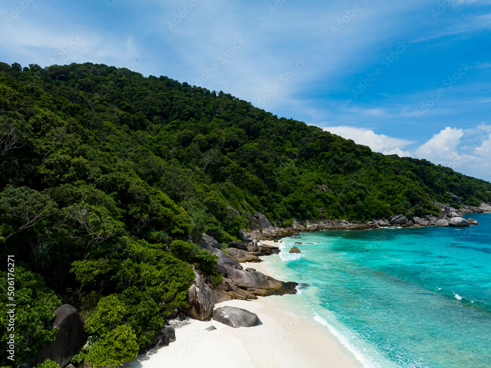 The island with  Blue water and beautifully bright.Azure beach and mountains as clear water background