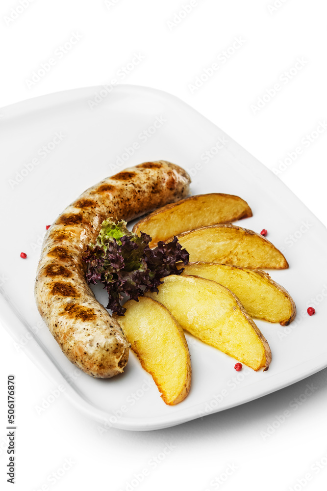 Pork sausage, meat in a plate. Photo of food on a white background