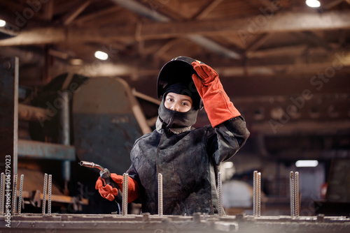 Profession gender worker, professional welder woman industrial production of metal structures