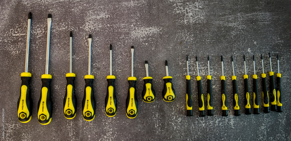 Professional set of screwdrivers on a gray background Professional set of screwdrivers on a gray background