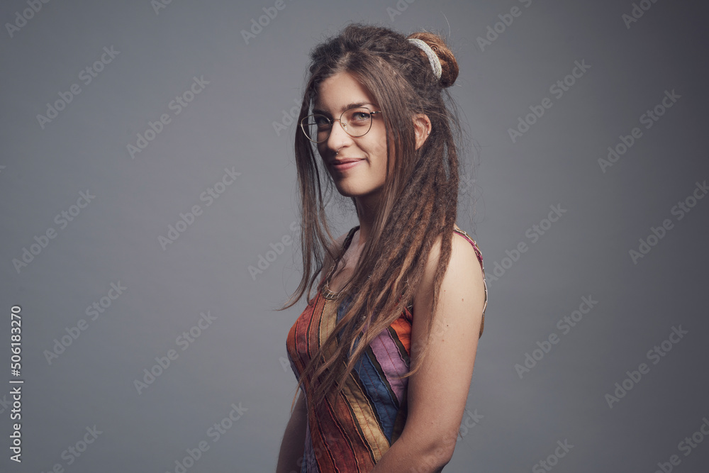 Portrait of young woman with piercing, dreadlocks and long hair Portrait of young woman with piercing, dreadlocks and long hair