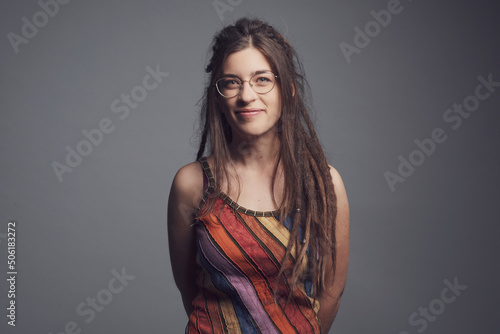 Bild auf Leinwand Portrait of young woman with piercing,  dreadlocks and long hair￼