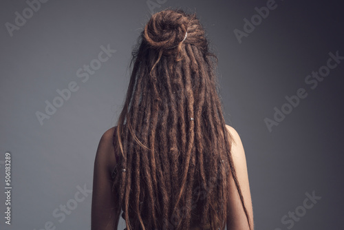 Portrait of young woman,  dreadlocks and long hair￼ photo