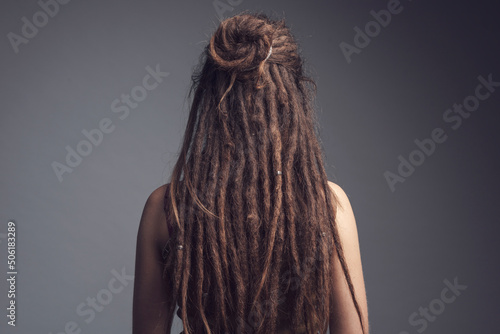 Portrait of young woman,  dreadlocks and long hair￼