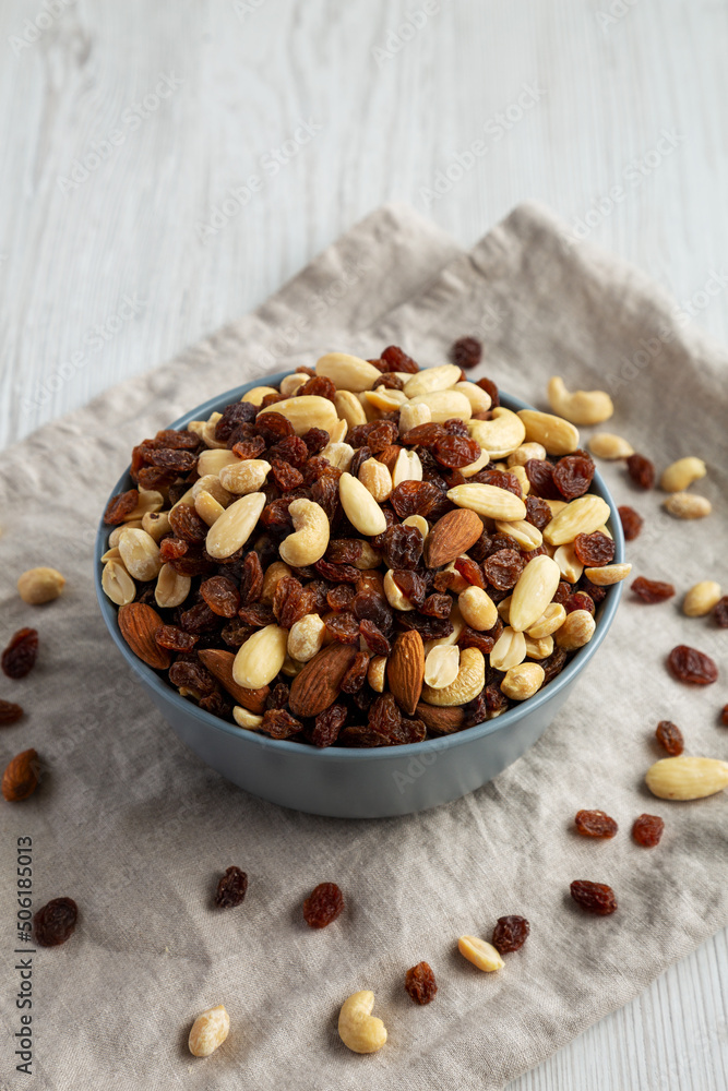 Raw Trail Mix with Nuts and Fruits in a Bowl, side view. Raw Trail Mix with Nuts and Fruits in a Bowl, side view.