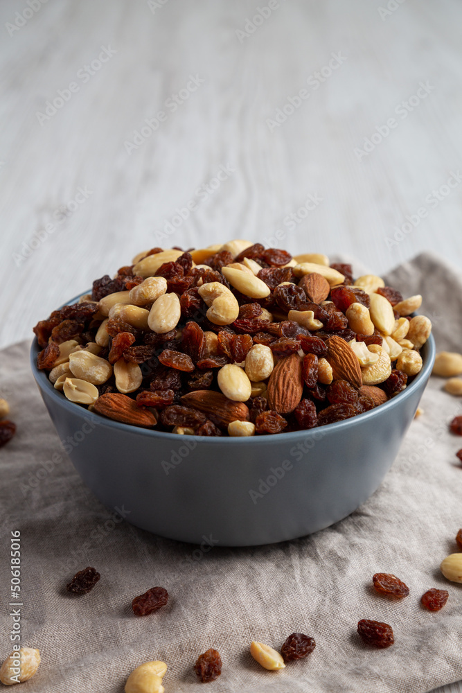 Raw Trail Mix with Nuts and Fruits in a Bowl, side view. Raw Trail Mix with Nuts and Fruits in a Bowl, side view.