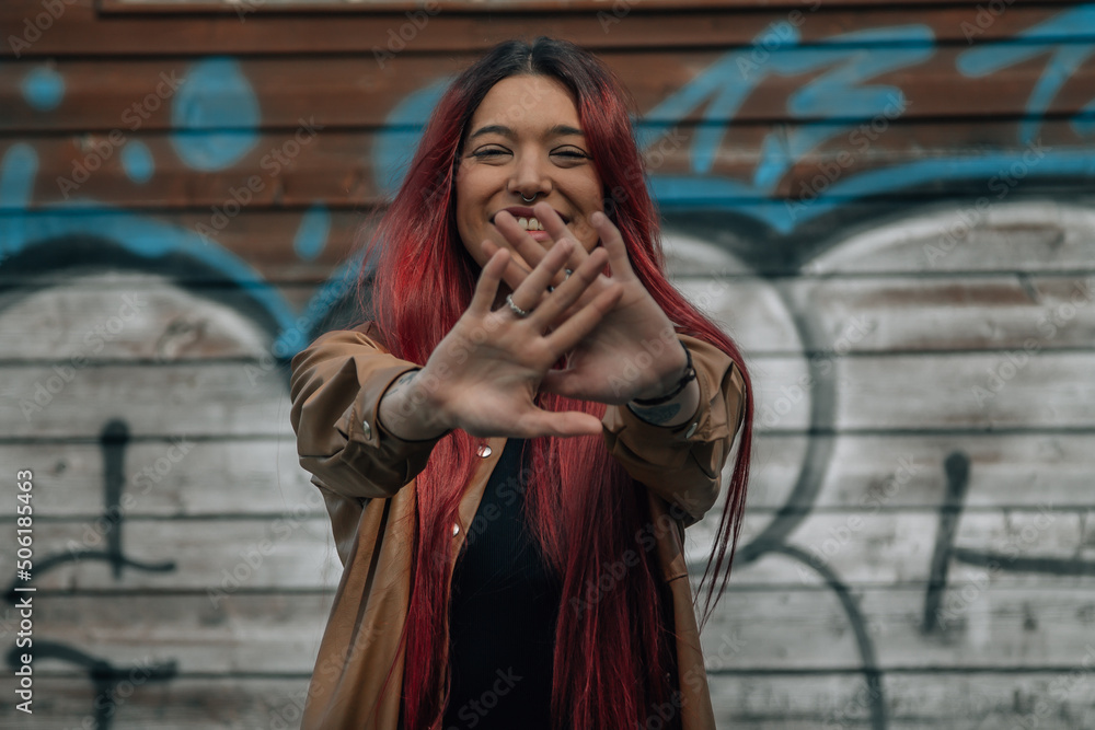 Obraz premium trendy urban girl with red hair and alternative style