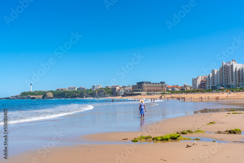 An elderly woman walking on the beach in Biarritz, Lapurdi. France, South West resort town