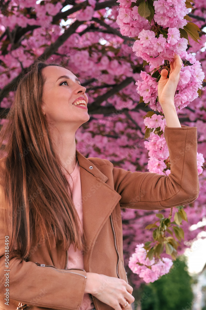 Fototapeta premium Portrait of a girl in sakura