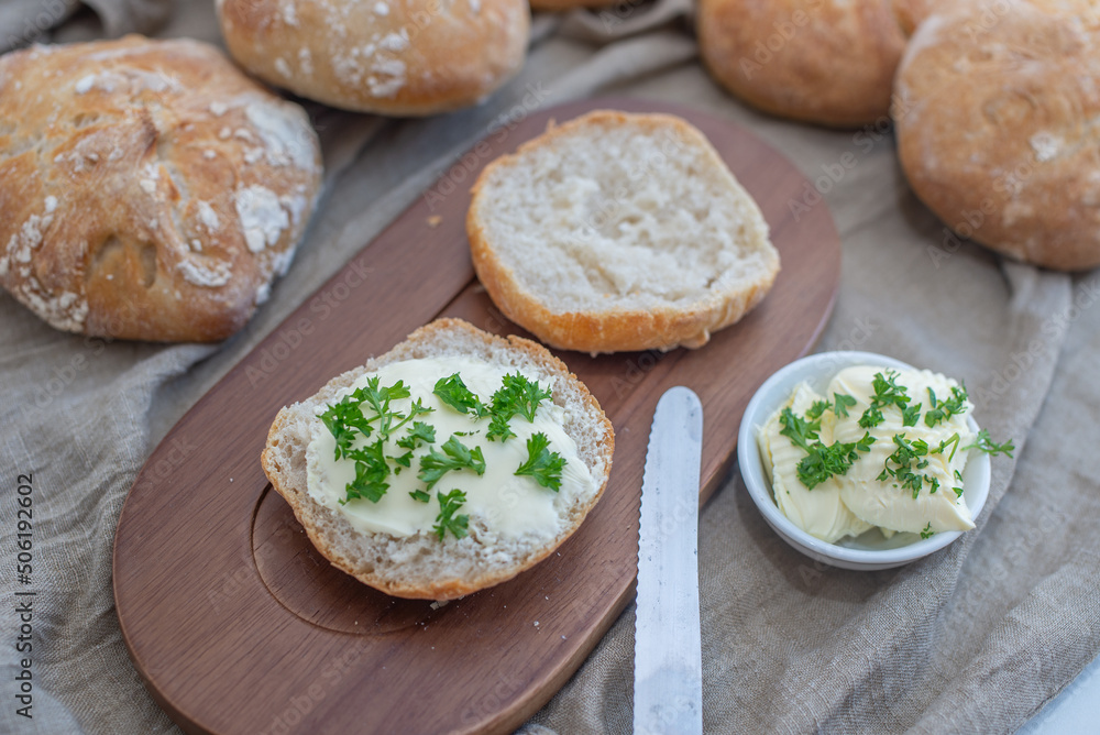 Bread basket, round bread rolls on dark table Bread basket, round bread rolls on dark table