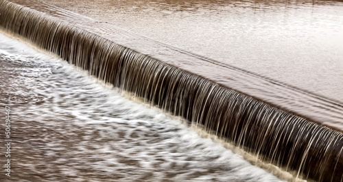 A small waterfall on the river in close-up in spring. Russia. Ural.