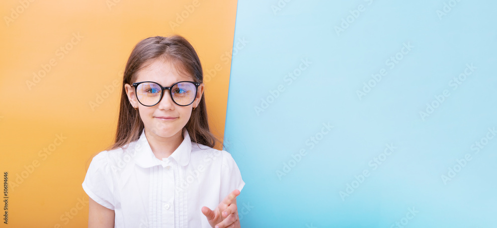 A 7-year-old girl with glasses with a smile Children's education, learning concept. Copy space A 7-year-old girl with glasses with a smile Children's education, learning concept. Copy space
