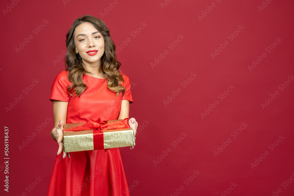 Woman is smiling gratefully on a red background Woman is smiling gratefully on a red background