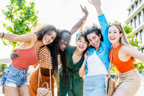 Group of five young women smiling and having fun, female university students celebrating their achievements, sisterhood and summer concept